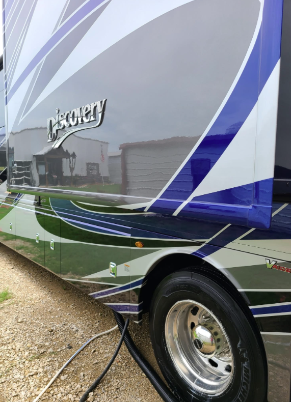 Clean Discovery motorhome with a mirror-like painted finish